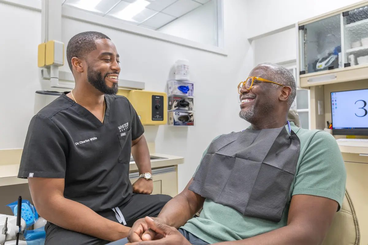 Dr. White sharing a laugh with a patient